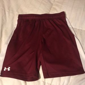 Youth long maroon and white under armor shorts.